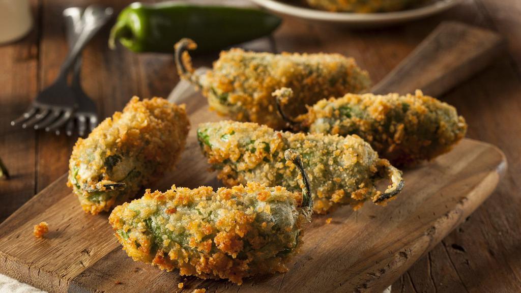 Jalapeño Poppers (4 Pcs) · Traditional jalapeño poppers filled with cream cheese and then baked to perfection.