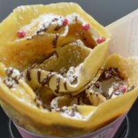 Banana Nutella Delight · Whipped cream, bananas, Nutella And Chocolate strawberry pearls topped with powdered sugar.
