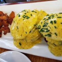 Lapsang Souchong Benedict · Poached eggs, lapsang souchong tea sausage, English muffin, green-tea-infused hollandaise, p...