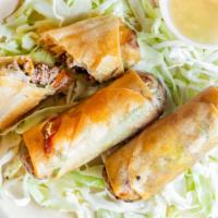 Veggie Spring Rolls · 3 Veggie spring rolls served with sweet and sour sauce.