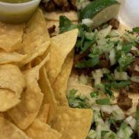 Carne Asada Taco · Grilled sirloin steak, citrus, garlic, cilantro, onions and roasted tomato salsa.