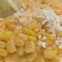 Elote · Corn off the cob, chipotle, lime and cotija.