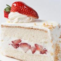 Strawberry Shortcake Slice · Delicate white cake filled and iced with fresh whipped cream and layered with sliced Califor...