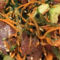 Ahi Poki Salad · Fresh tuna, red onions, seaweed, Hawaiian seasalt, jalapeno with chef special sauce.