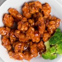 Orange Chicken · Tender crispy chicken glazed with a sweet tangy orange sauce. served with steamed rice.