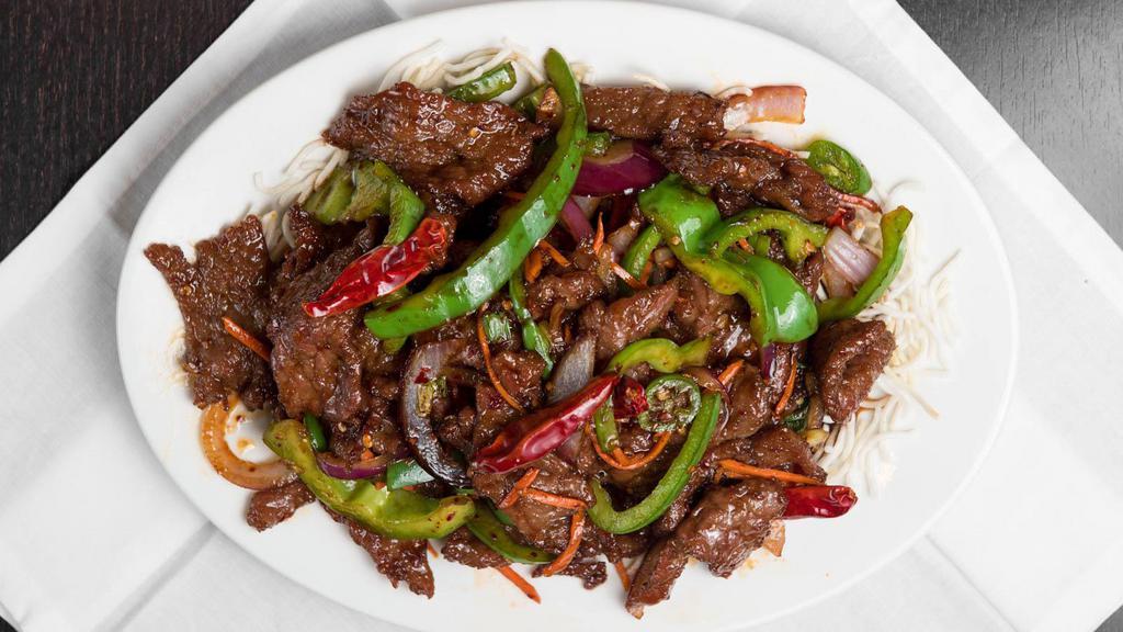 Mongolian Beef · Hot. Tender beef strips with skiced bell pepper, onion, and carrots stir fried in a spicy mangolian sauce.