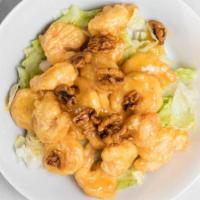 Honey Walnut Shrimp · Crispy shrimp over lettuce glazed with honey walnut sauce topped with walnuts.