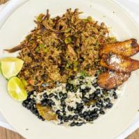 Vaca Frita · Gluten free. Shredded beef marinated in lime juice and sautéed with onions, garlic, and swee...