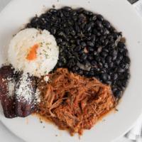 Pabellón · Gluten free. Shredded beef cooked in a tomato based sauce with red peppers, onions, and spic...