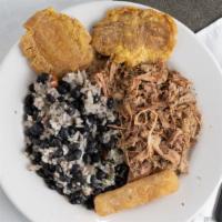 Lechon Asado · Gluten free. Roasted marinated pork with sautéed onions. Served with congri, fried yuca, and...
