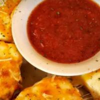 Cheese Bread · French-style garlic bread baked with cheddar and mozzarella. Served with marinara.