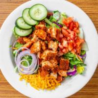 Buffalo Chicken Salad · Buffalo chicken strips, cheddar cheese, diced tomatoes, cucumbers, and red onions served wit...