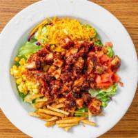 Bbq Chicken Salad · Crispy bbq chicken strips, corn, tortilla strips, diced tomatoes and cheddar cheese