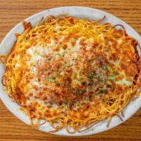 Italian Sausage Parmesan · Grilled Italian sausage served on a bed of spaghetti and smothered in marinara sauce and mel...