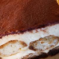 Tiramisu · Ladyfingers bathed in espresso and rum, layered with mascarpone cheese and lightly sprinkled...