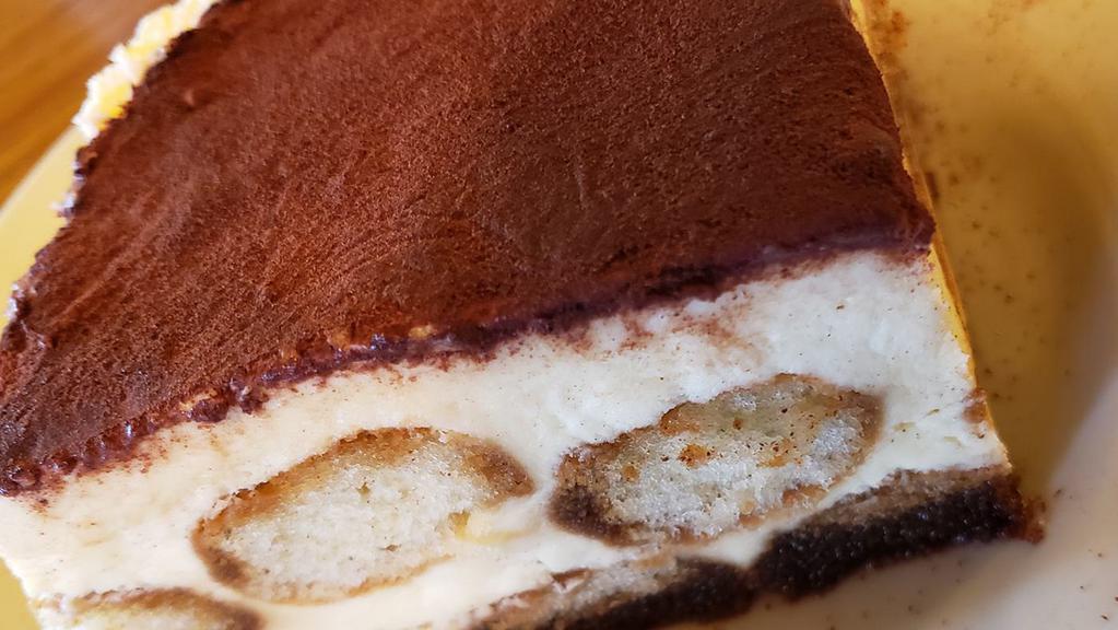 Tiramisu · Ladyfingers bathed in espresso and rum, layered with mascarpone cheese and lightly sprinkled with cocoa powder. An authentic Italian treat!