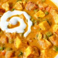 Panner Muttar (Peas) Curry · Cottage cheese and green peas cooked in Indian style mildly spiced soft curry and garnished ...