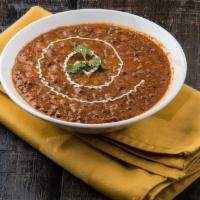 Dal Makhani · All meals come with naan bread and a side of pickles and onions. Whole black lentils simmere...