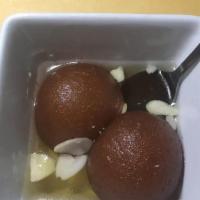 Gulab Jamun · Fried rich cottage cheese dumplings steeped in infused syrup
