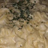Fettuccine Alfredo · Imported pasta tossed in our made to order rich cream sauce. It comes with a cup of soup or ...