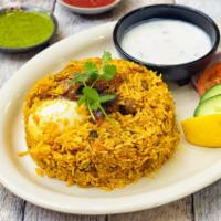 Ambur Chicken Biryani · Basmati rice cooked with bone-in chicken, onions tomatoes, yogurt, herbs, and blended spices.
