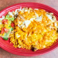 Arroz Con Pollo · Chicken breast strips seasoned and fried with tomatoes, onions, and mushrooms. Served on a b...