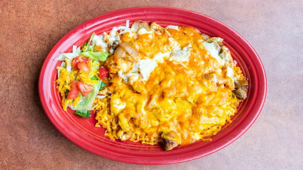Arroz Con Pollo/Chicken · Chicken breast strips seasoned and fried with tomatoes, onions, and mushrooms. Served on a bed of Spanish rice and covered in a tasty red sauce. Topped with Jack and Cheddar cheeses. Dinner entrées served with Spanish rice and your choice of flour or corn tortillas.
