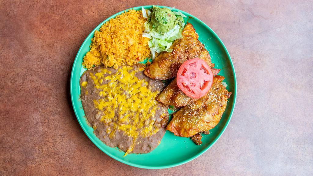 Chicken Tacos Rancheros · Marinated and grilled chicken in three corn or two flour tortillas and sprinkled with Parmesan cheese. Served with pico de gallo and guacamole. Dinner entrées served with Spanish rice and your choice of refried, whole, or black beans and flour or corn tortillas.