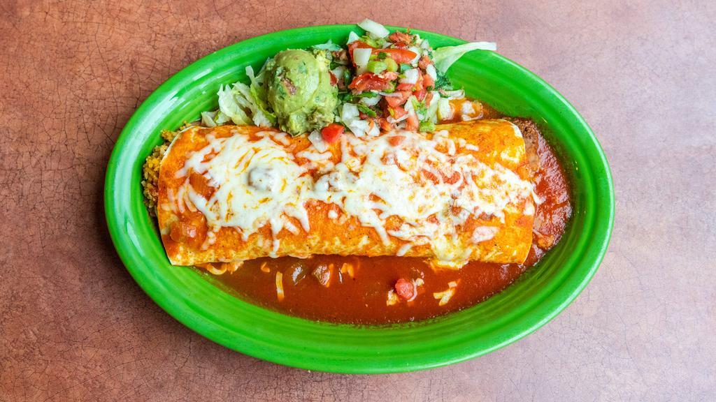 Carne Asada Burrito · Charbroiled skirt steak strips, Spanish rice, and refried beans wrapped in a flour tortilla. Topped with melted Jack cheese and burrito sauce. Served with pico de gallo and guacamole.