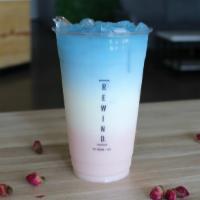 Rose Milk Latte [Caffeine Free] · Rose milk +  topped with non caffeinated blue tea. Contains Dairy. Non-dairy options also av...