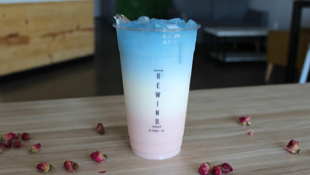 Rose Milk Latte [Caffeine Free] · Rose milk +  topped with non caffeinated blue tea. Contains Dairy. Non-dairy options also available.