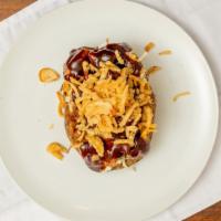 Bbq Brisket Potato · Smoked brisket shredded cheese, fresh coleslaw, Memphis, and sweet BBQ sauce topped with oni...