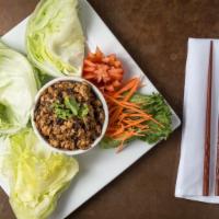 Chicken Lettuce Wrap · Stir-fried ground chicken breast, oyster mushrooms and fresh ground ginger. Served with lett...