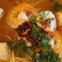 Tom Yum · A traditional hot & sour Thai style clear soup simmered with mushrooms, lemongrass, lime lea...