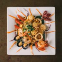 Yum Talay Salad · Steamed prawns, scallops, calamari and mussels. Tossed with spicy lime sauce, lemongrass, to...