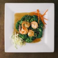 Garlic Prawns · Sauteed prawns with fresh garlic, black pepper and cilantro. Served on a bed of steamed broc...
