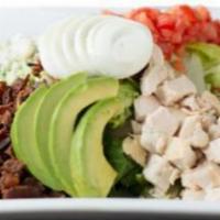 Chef'S Chopped Cobb · Chilled romaine lettuce topped with diced chicken, applewood smoked bacon, bleu cheese crumb...