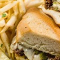 South Philly Cheese Steak · Shaved sirloin grilled with onions, peppers, and smothered with provolone cheese, served on ...