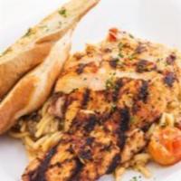 Grilled Cajun Chicken Alfredo · Blackened grilled chicken sautéed in our Cajun alfredo sauce with spaghetti, garlic, cherry ...