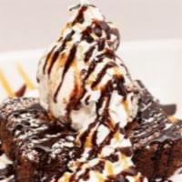 Chocolate Brownie Sundae · An in house baked brownie served warm with vanilla ice cream, and drizzled with chocolate an...