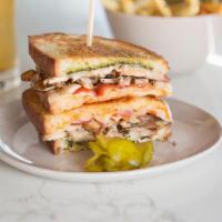 80'S Chicken Melt · Grilled Chicken, Bacon, Cheese, Pesto, Pickled Peppers.