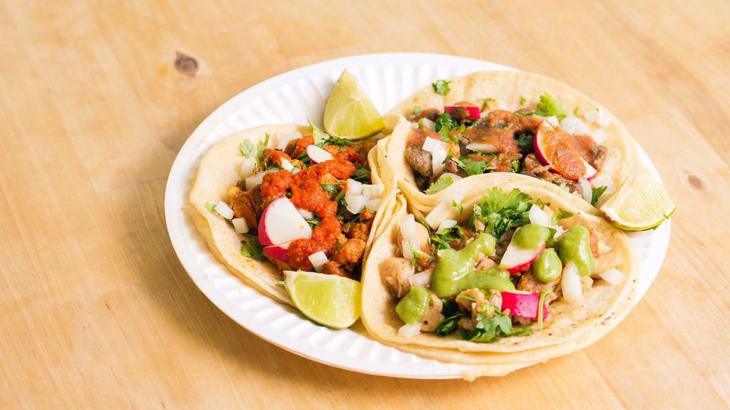 Soft Taco · Street style taco with soft corn tortillas, choice of meat, cilantro, onion, radish, and lime.