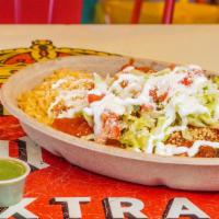 Enchiladas · Two enchiladas on a bed of rice and beans with lettuce, scallions, tomato, crema and
cotija ...