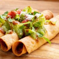 Taquitos · Three crispy flute style shredded chicken taquitos served with lettuce, tomato, cotija chees...