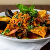 Seafood Cioppino With Pasta Capellini · Sautéed mussels, clams, scallops, shrimp, fish, crusted peppers, garlic, tomatoes and white ...