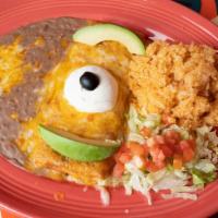 Chimichanga · Seasoned shredded beef, pork or chicken breast wrapped in a deep fried flour tortilla. Toppe...