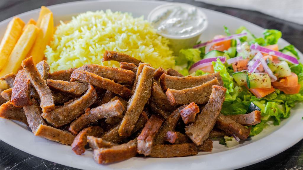 Gyros · Sliced thin seasoned beef and lamb mix over rice, choice of salad (Greek, tabouli, mint, or cucumber), feta cheese, black olives, pita bread, and homemade sauce (ranch or tzatziki).