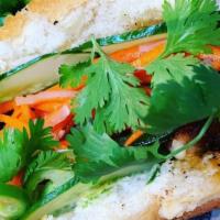 Chicken Banh Mi · Vietnam version, grilled chicken, mayonnaise, carrots, daikon slaw, jalapeños, cucumbers, an...