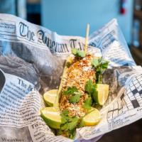 Street Corn · A tasty grilled corn in the cob with cotija cheese, mayonnaise, and tajin.