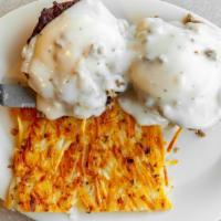 Sausage Benedict · Sausage patties and poached eggs on split biscuits and smothered with sausage gravy served w...